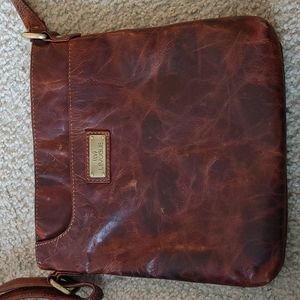 Brown in color crossbody handbag